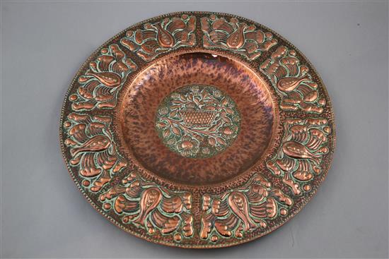 An Arts & Crafts Newlyn circular copper charger, by John Pearson, 15.25in.